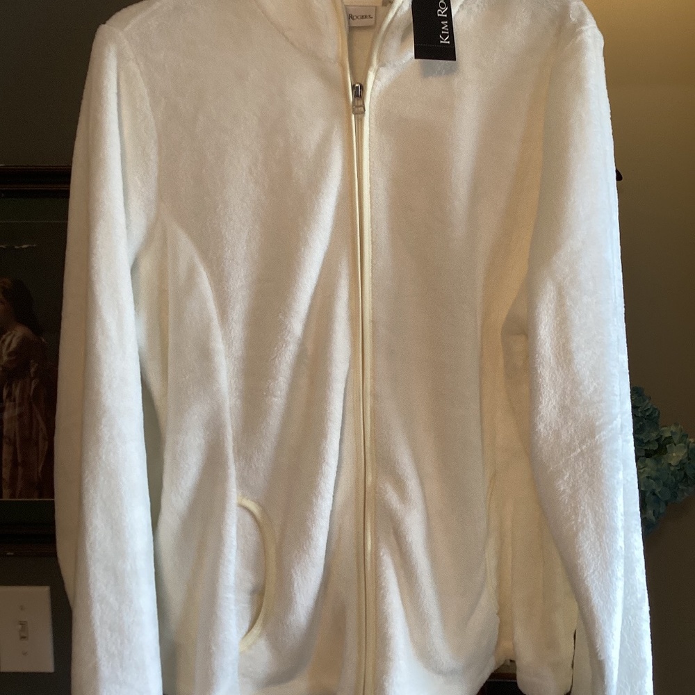 Kim Rogers white fleece jacket..